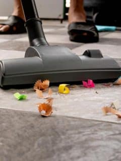 vacuuming pencil shavings off tile floor
